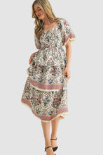 Load image into Gallery viewer, Woman wearing a vintage floral boho midi dress with layered skirt, soft flowy fabric, and elegant summer style outfit