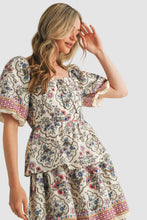 Load image into Gallery viewer, Woman wearing a vintage floral boho midi dress with layered skirt, soft flowy fabric, and elegant summer style outfit