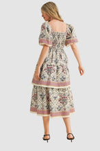 Load image into Gallery viewer, Woman wearing a vintage floral boho midi dress with layered skirt, soft flowy fabric, and elegant summer style outfit

